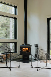 Modern EPA-certified wood burning stove heating a living room