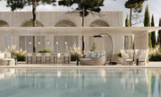 Bromic Eclipse Portable electric freestanding heater beside an outdoor pool lounge at dusk
