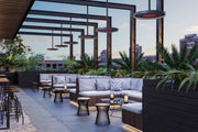 Bromic Eclipse Electric heaters on 48 inch straight poles in an industrial-style outdoor space