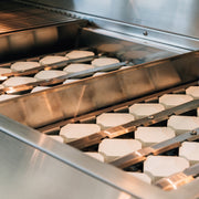 Estate grill heat zone separators and briquettes